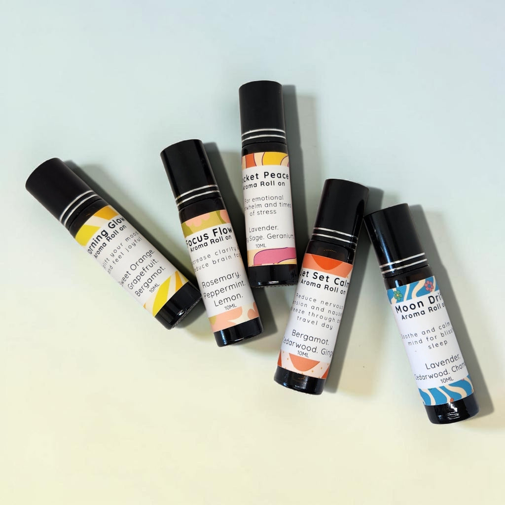 Set of five aroline rollerball bottles on a light background