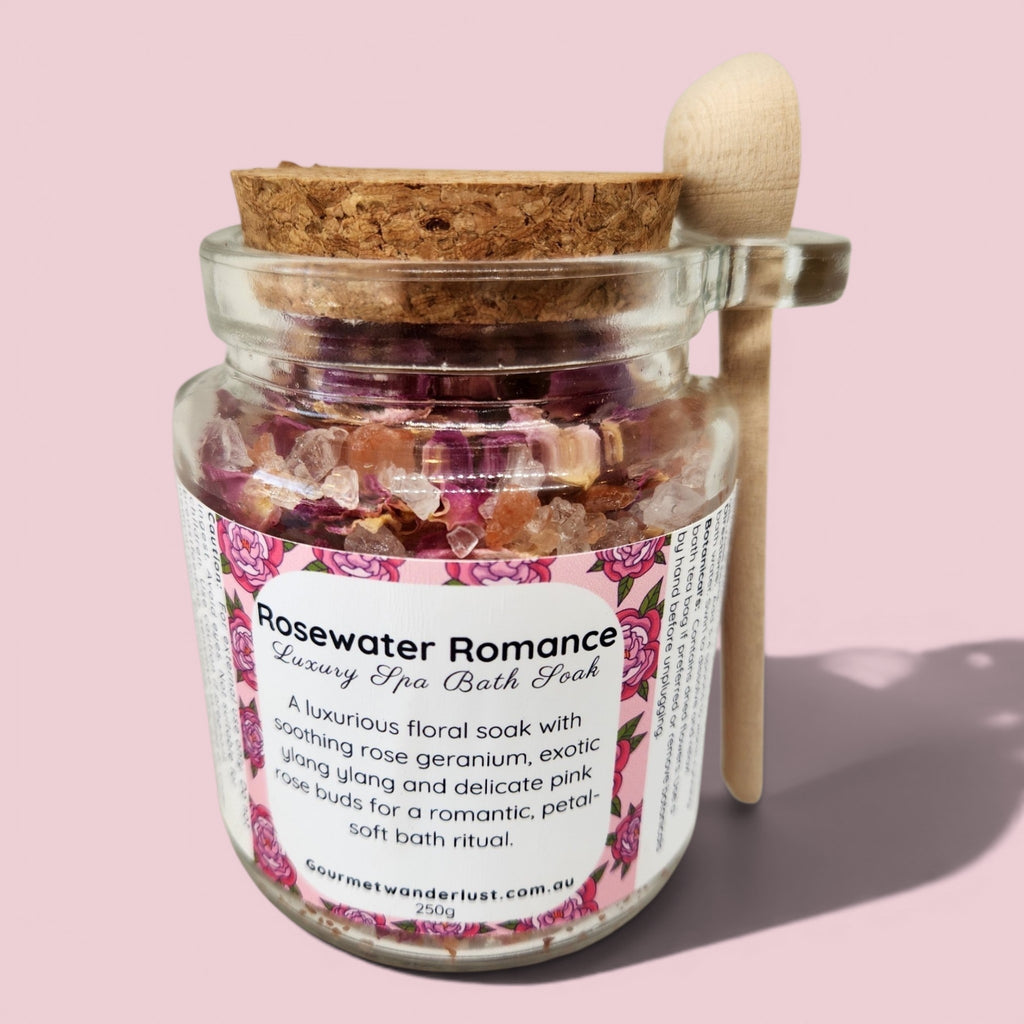 Glass jar with bath soak and cork lid on a pink background