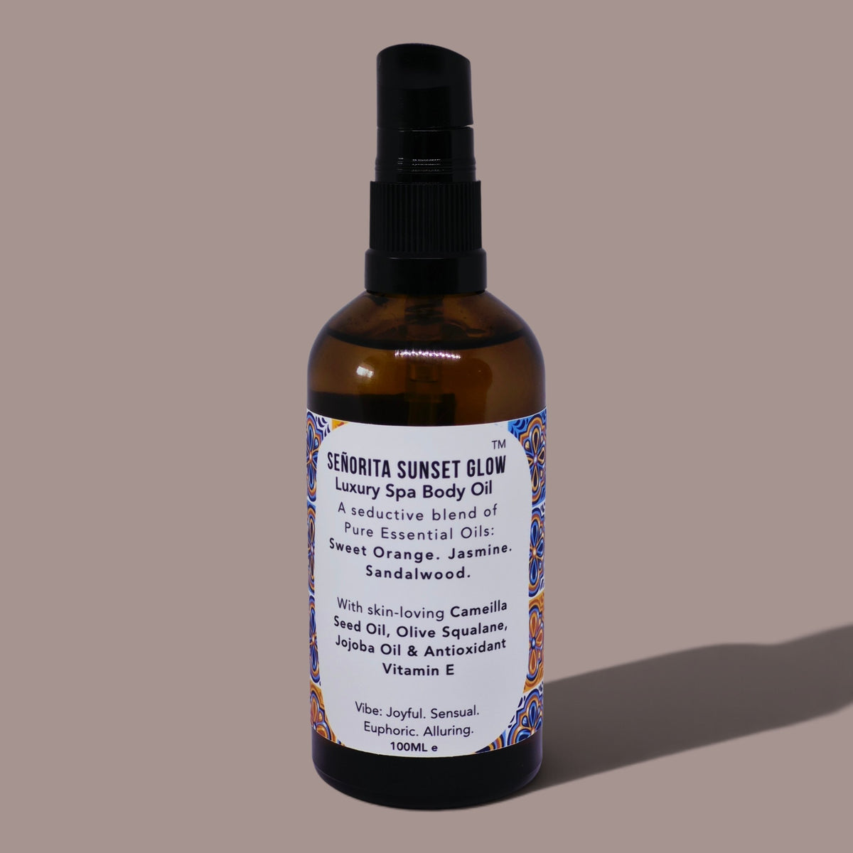 Senorita Sunset Glow Body Oil in a glass amber bottle